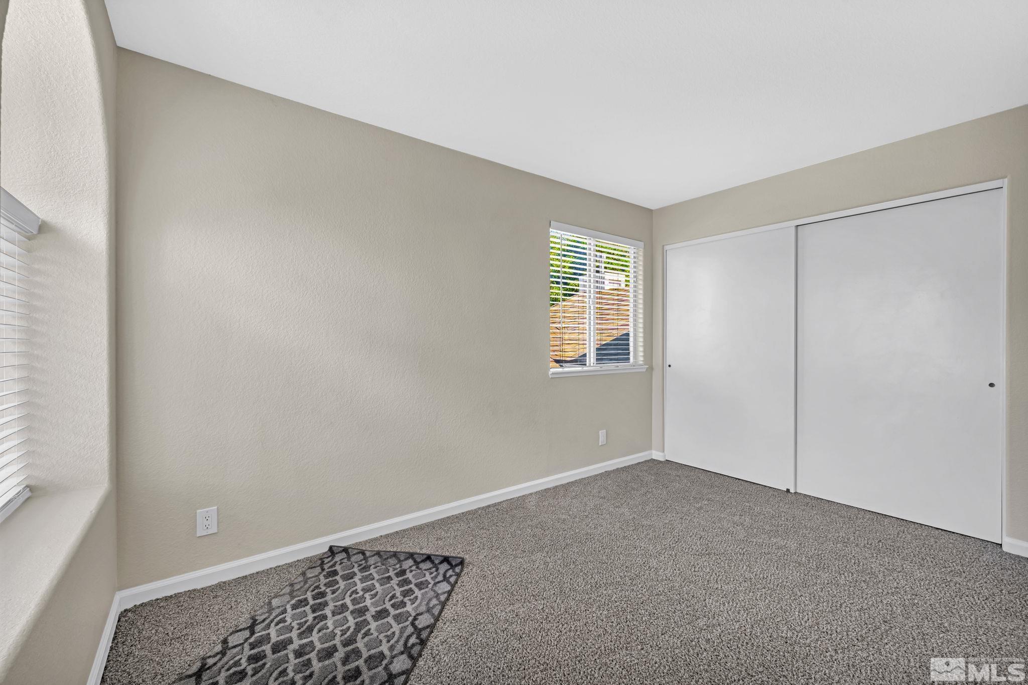 7491 Wheeldale Circle Reno, NV 89511 - Photo 26 of 33 a view of an empty room with a window