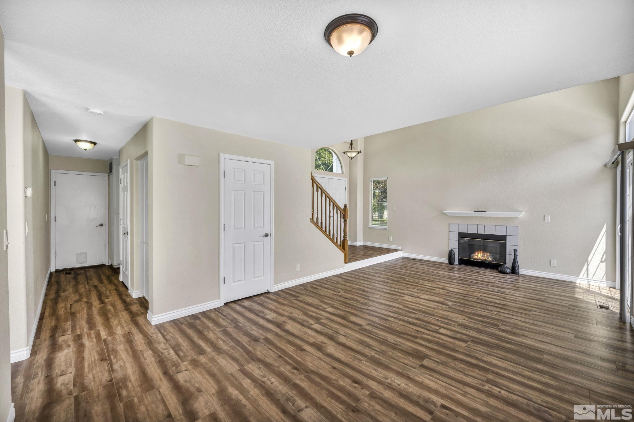 7491 Wheeldale Circle Reno, NV 89511 - Photo 4 of 33 a view of a livingroom with wooden floor and a fireplace