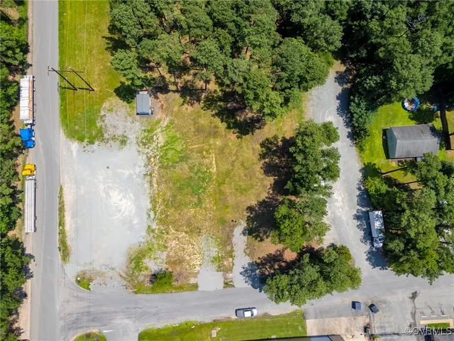 an aerial view of a residential houses with outdoor space