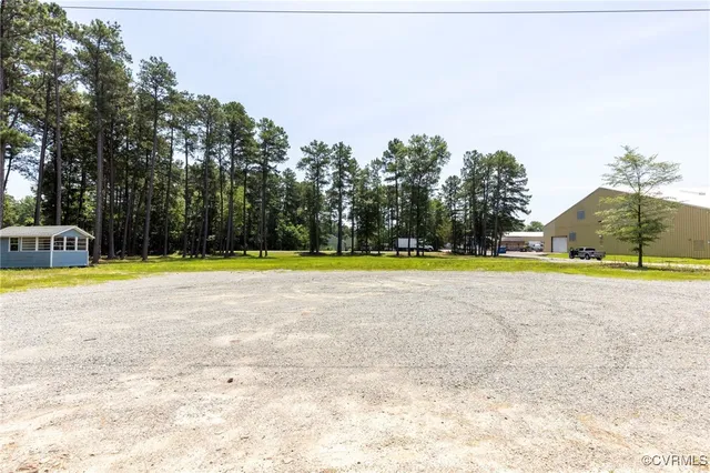 a view of a swimming pool and a yard