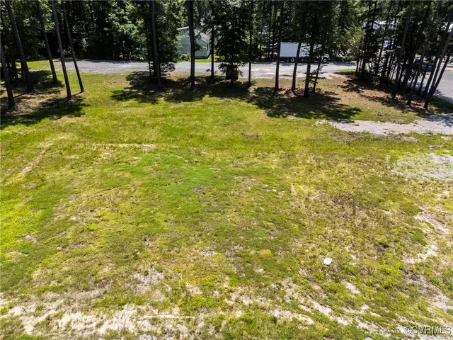 a view of a yard with swimming pool