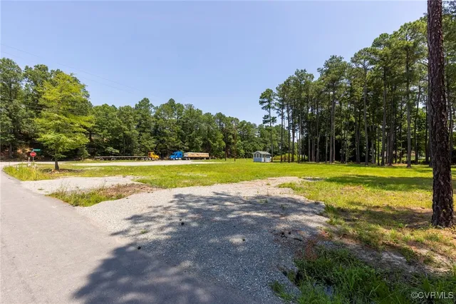 a view of a swimming pool with a yard