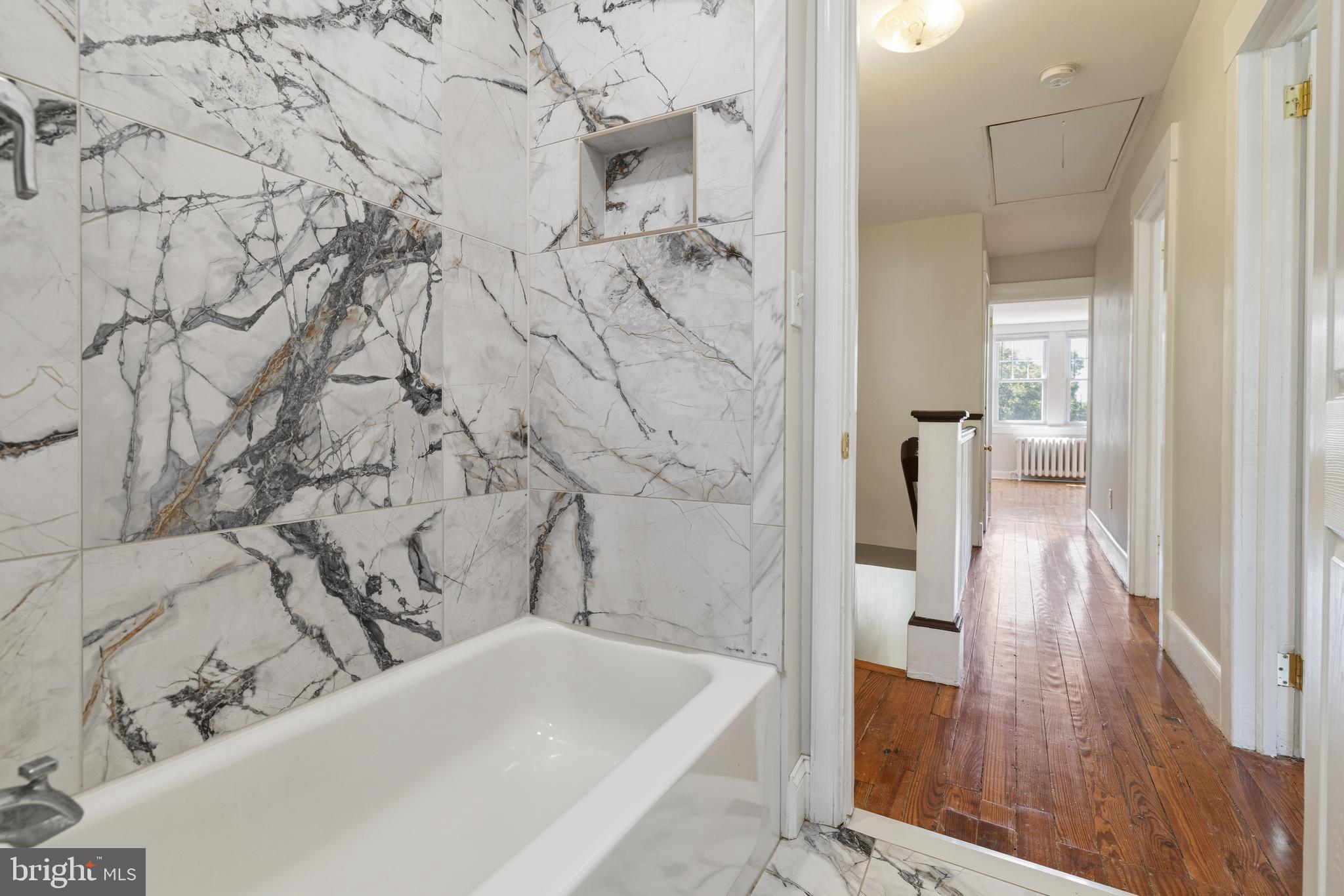 229 Wayne Avenue Narberth, PA 19072 - Photo 26 of 35 a bathroom with a bathtub and a shower