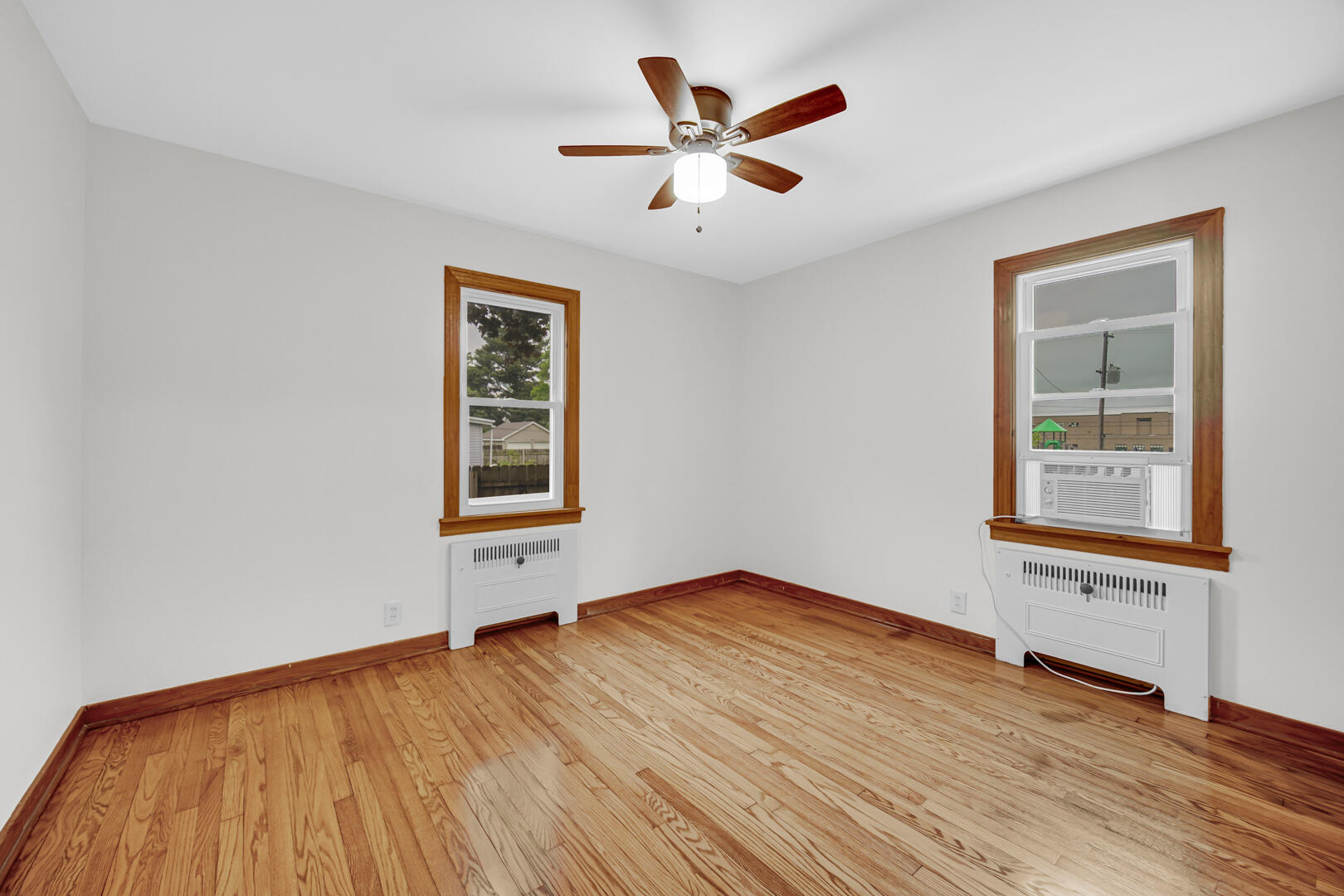 602 Ohio Street Walkerton, IN 46574 - Photo 12 of 31 a view of an empty room with wooden floor and a window