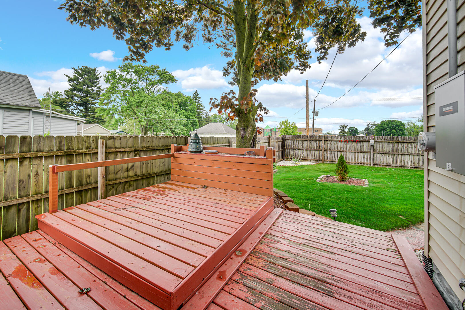 602 Ohio Street Walkerton, IN 46574 - Photo 19 of 31 a view of a wooden deck and a yard