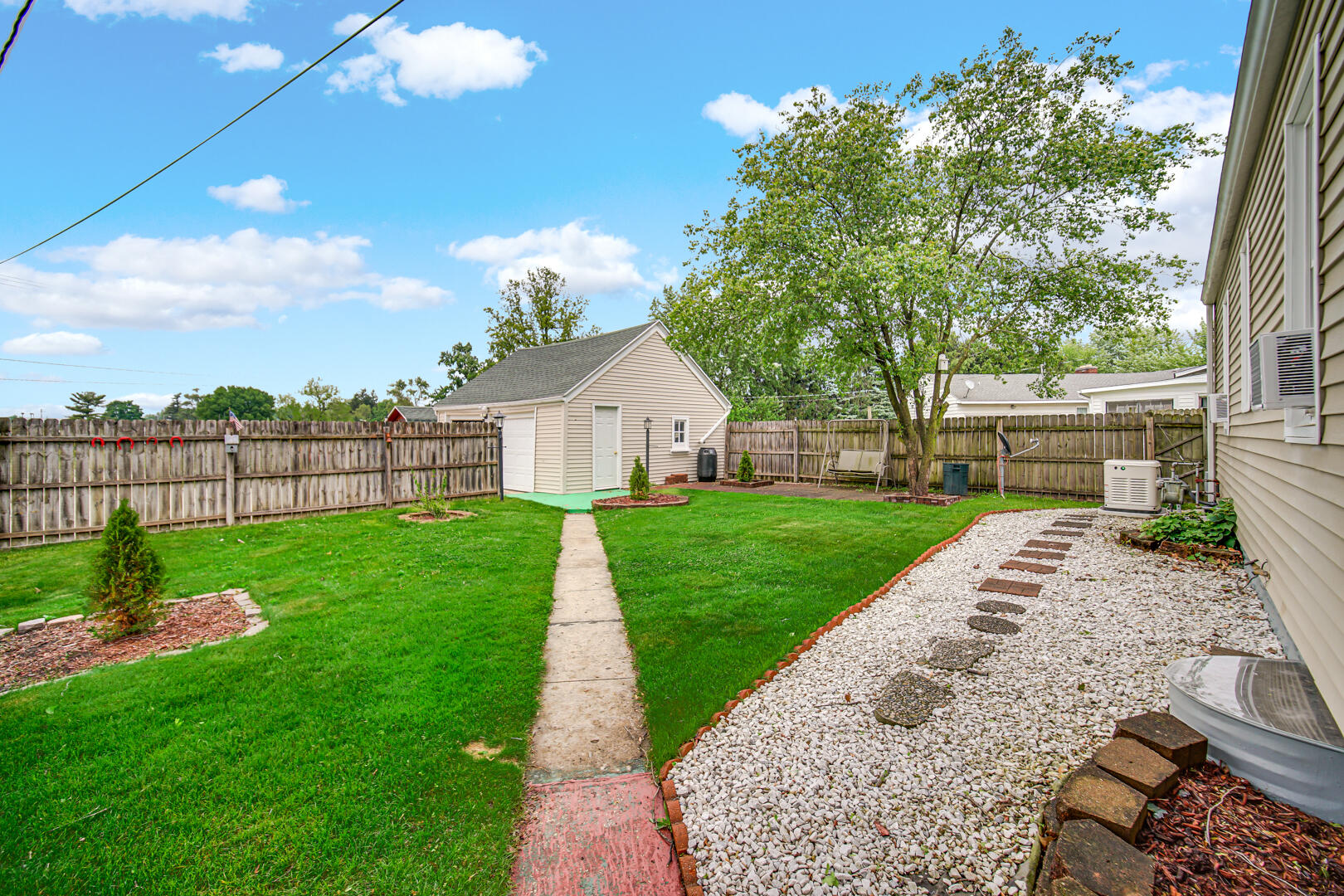 602 Ohio Street Walkerton, IN 46574 - Photo 21 of 31 a view of a backyard with a garden