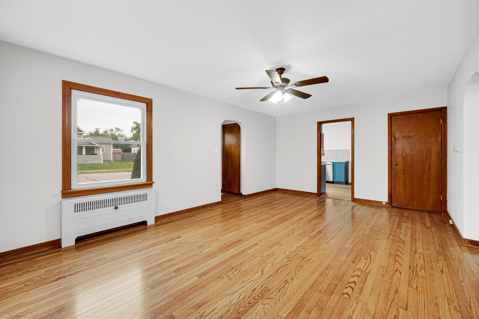 602 Ohio Street Walkerton, IN 46574 - Photo 3 of 31 a view of an empty room with a window and wooden floor