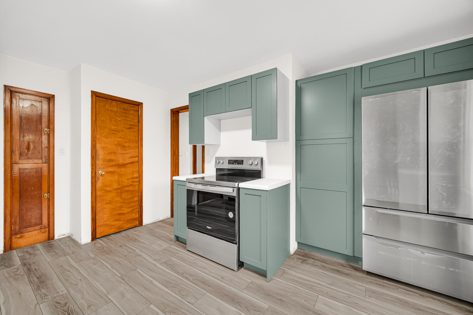 602 Ohio Street Walkerton, IN 46574 - Photo 8 of 31 a kitchen with a refrigerator and a stove top oven
