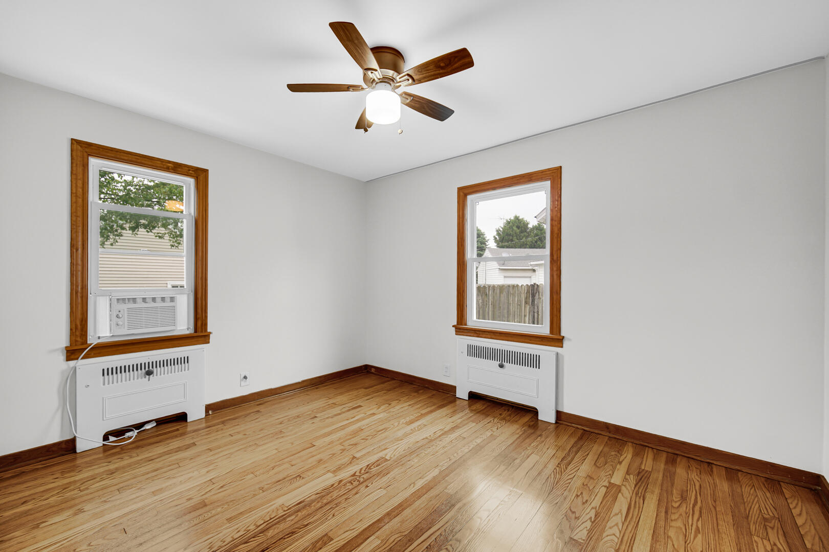 602 Ohio Street Walkerton, IN 46574 - Photo 9 of 31 a view of an empty room with wooden floor and a window