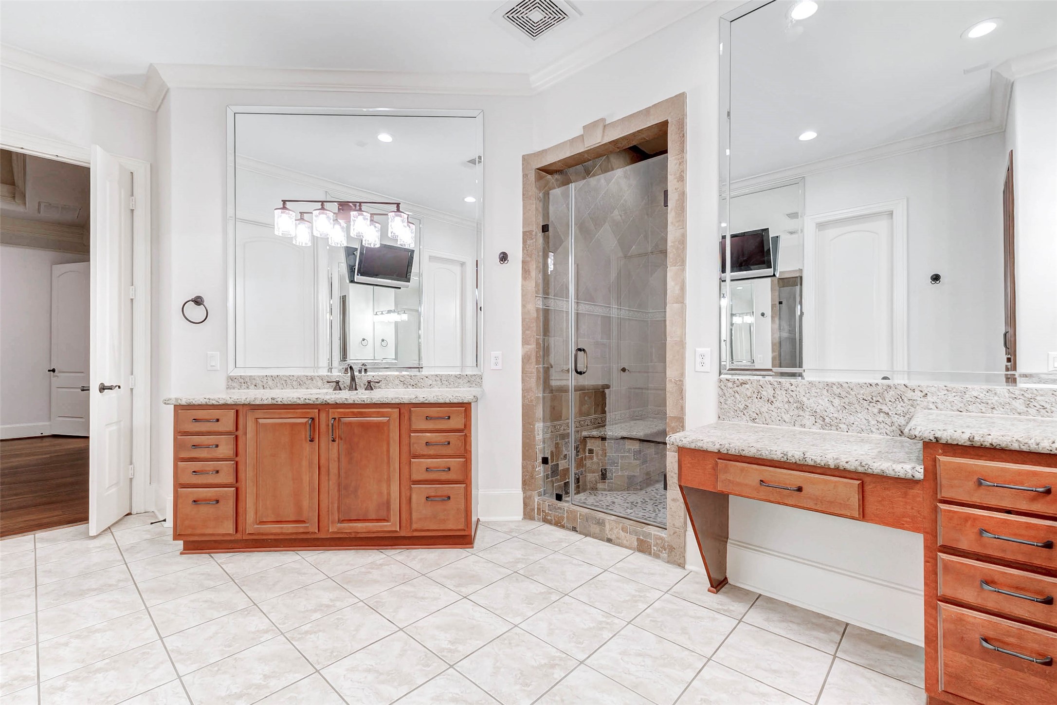 3509 Mirror Court Spring, TX 77388 - Photo 19 of 45 a spacious bathroom with a granite countertop sink a mirror a shower and a bathtub