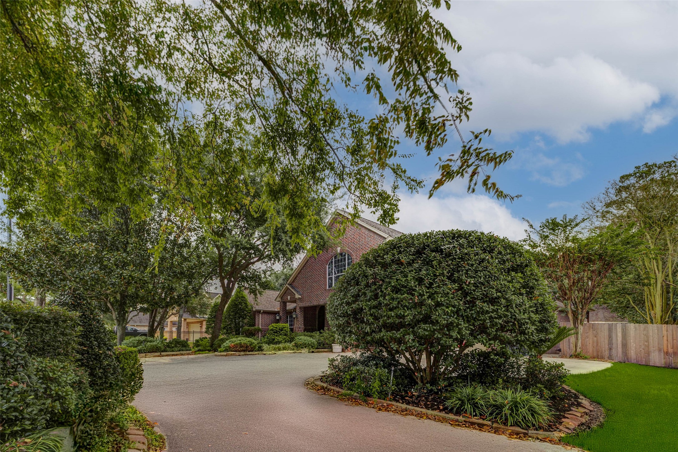 3509 Mirror Court Spring, TX 77388 - Photo 43 of 45 a view of a street with flower plants and wooden fence