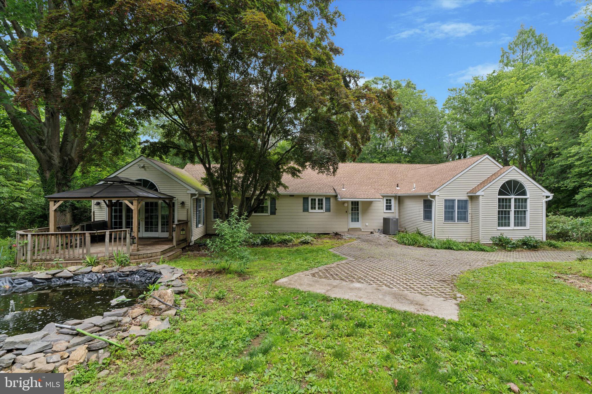 414 Darlington Road Media, PA 19063 - Photo 38 of 51 a front view of a house with a yard and trees