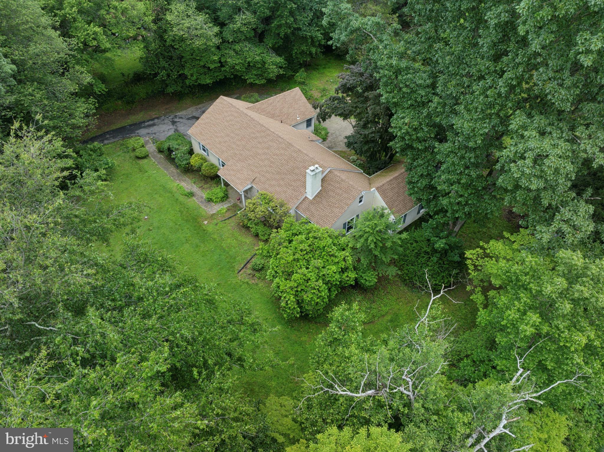 414 Darlington Road Media, PA 19063 - Photo 45 of 51 an aerial view of a house with a yard and trees all around