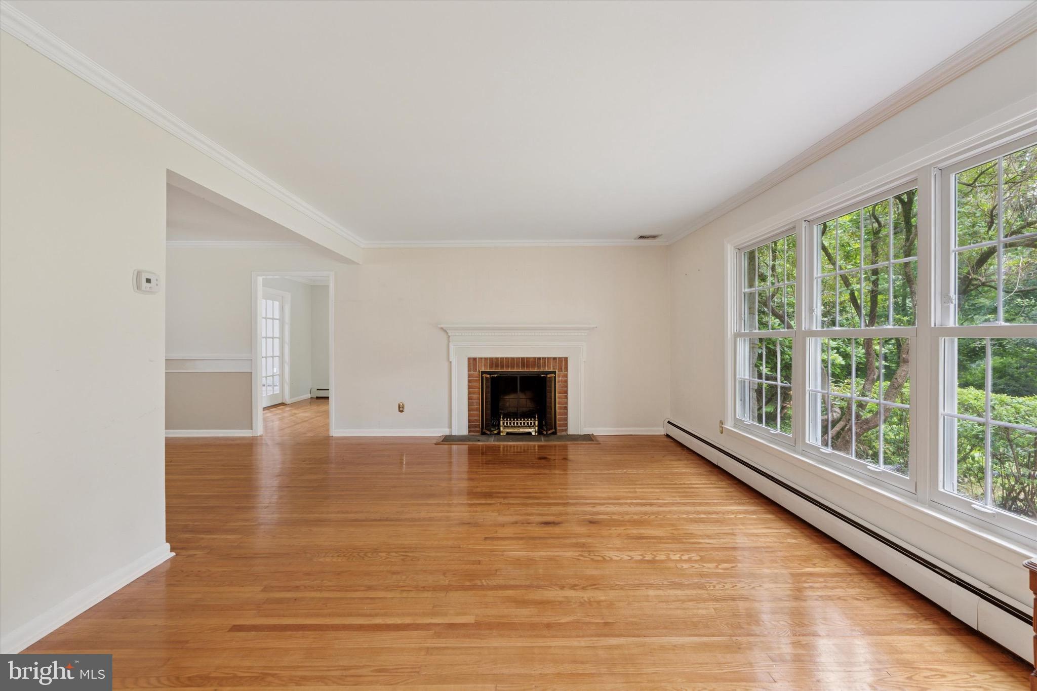 414 Darlington Road Media, PA 19063 - Photo 6 of 51 a view of an empty room with glass door and windows