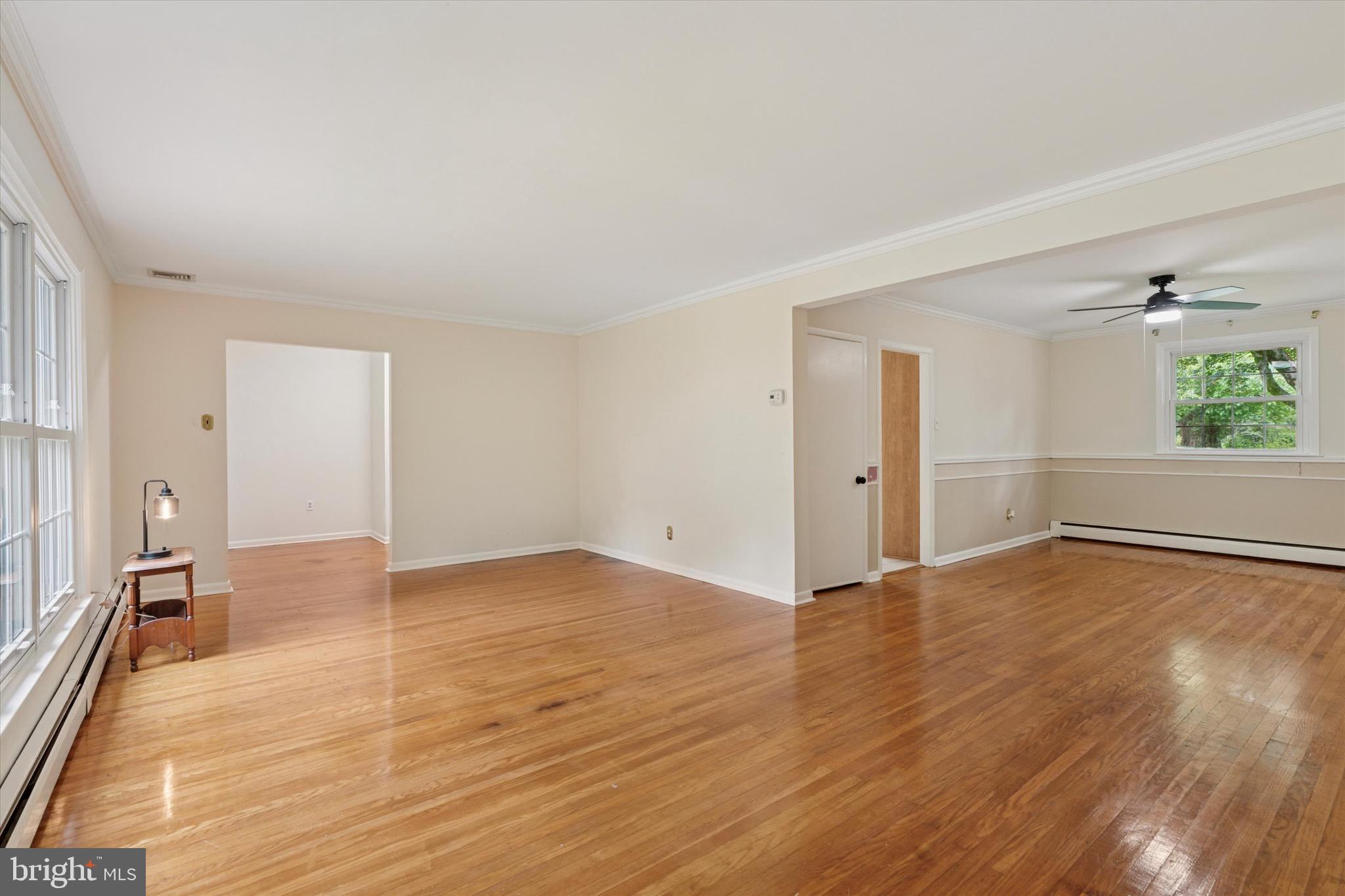 414 Darlington Road Media, PA 19063 - Photo 8 of 51 a view of an empty room with wooden floor and a window
