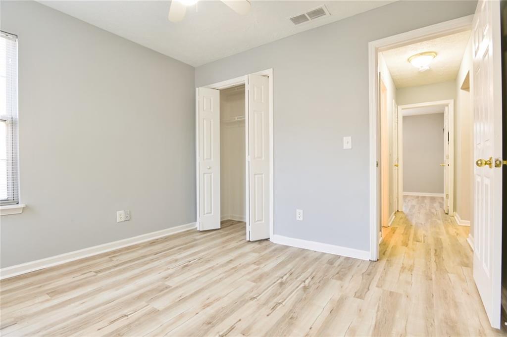 1255 Summit Point Lane Snellville, GA 30078 - Photo 20 of 41 a view of a room with wooden floor and a bathroom