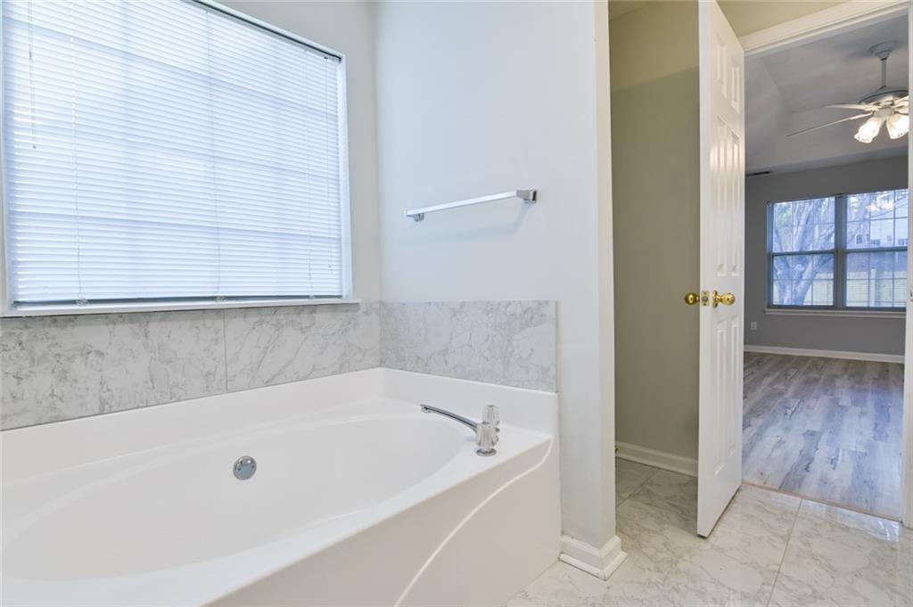 1255 Summit Point Lane Snellville, GA 30078 - Photo 24 of 41 a bathroom with a bathtub