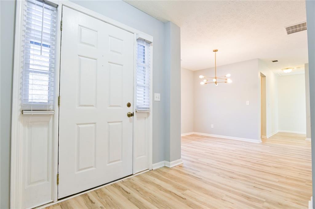 1255 Summit Point Lane Snellville, GA 30078 - Photo 4 of 41 a view of an empty room with wooden floor