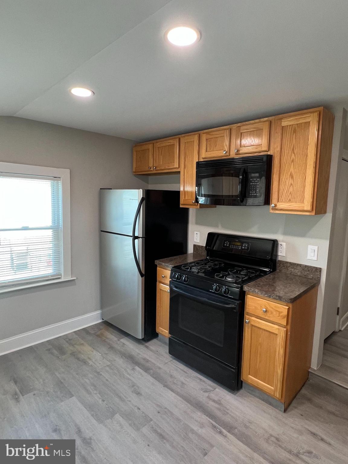 30 Spruce Avenue, Unit A Maple Shade, NJ 08052 - Photo 13 of 71 a kitchen with a stove and a refrigerator
