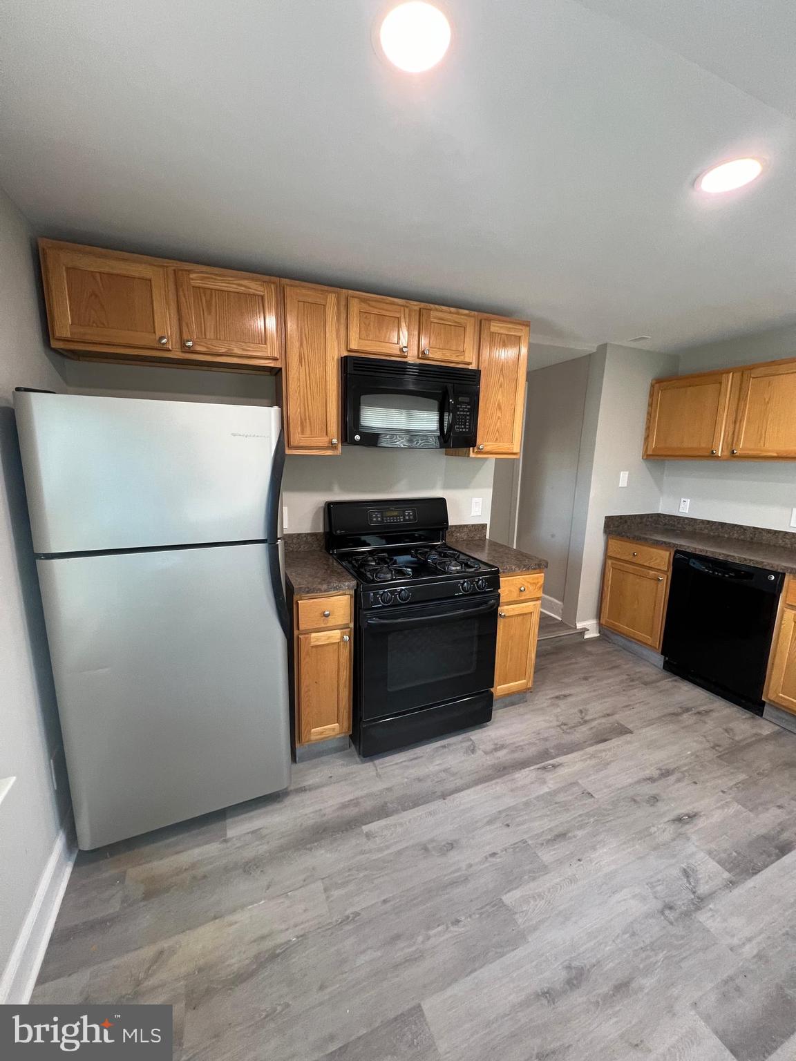 30 Spruce Avenue, Unit A Maple Shade, NJ 08052 - Photo 16 of 71 a kitchen with a refrigerator and a stove top oven