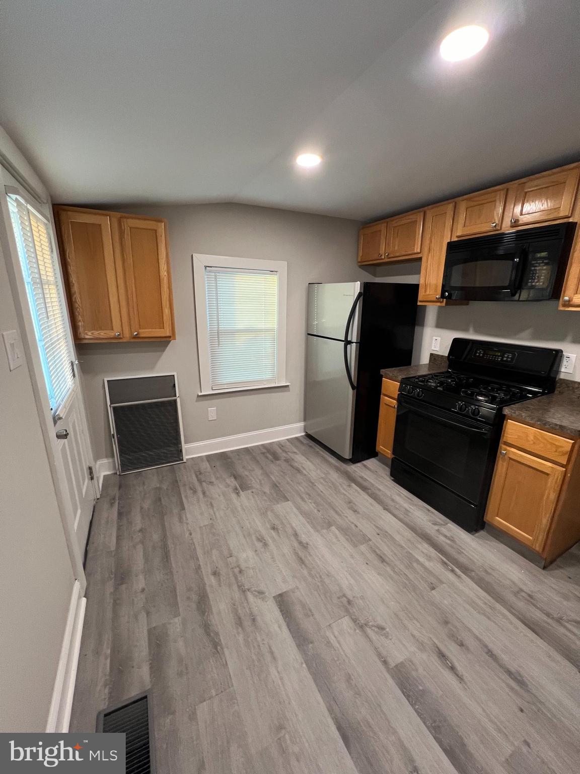 30 Spruce Avenue, Unit A Maple Shade, NJ 08052 - Photo 17 of 71 a kitchen with a refrigerator and a stove top oven