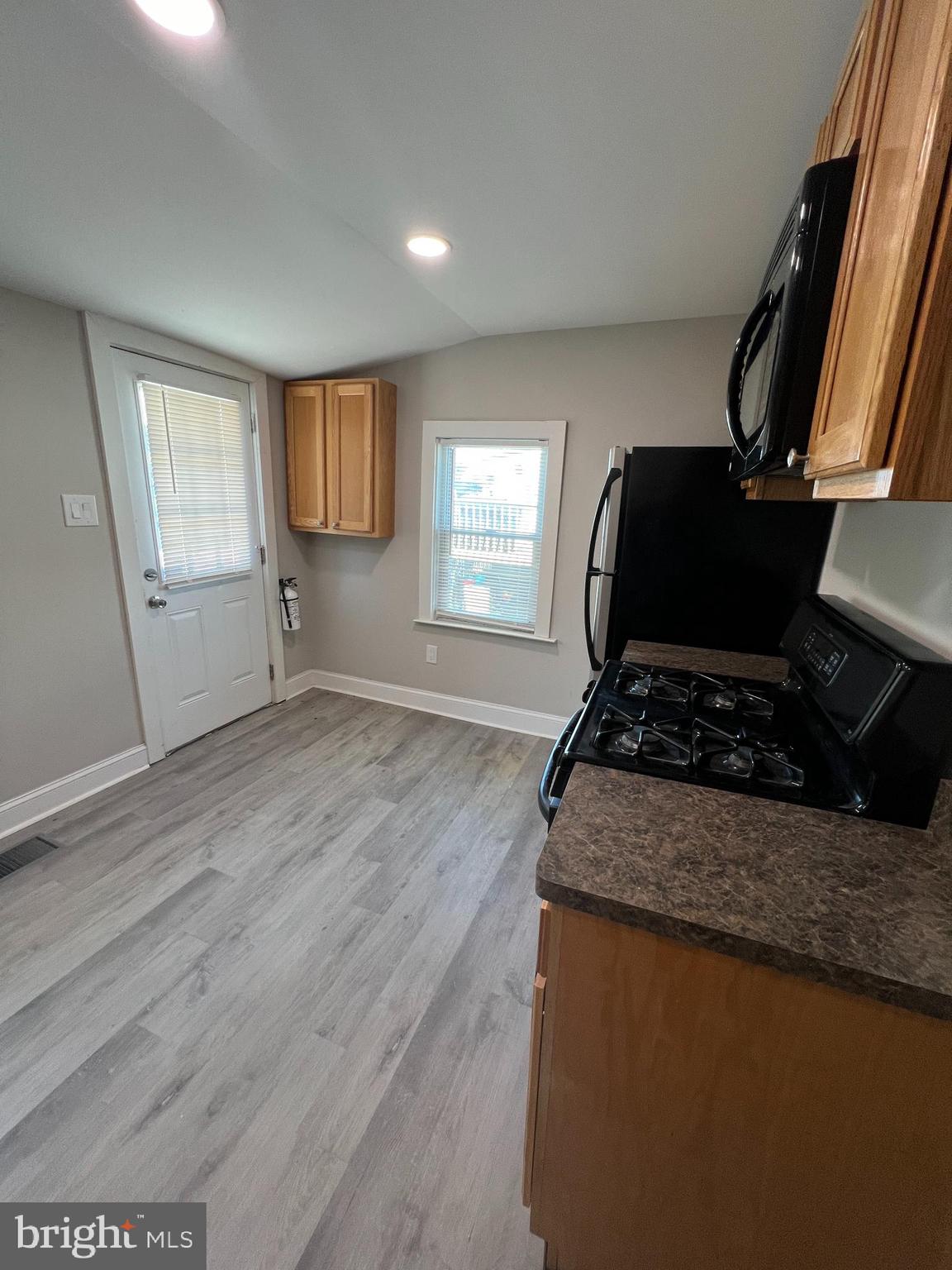 30 Spruce Avenue, Unit A Maple Shade, NJ 08052 - Photo 19 of 71 a kitchen with granite countertop a stove and a wooden floor