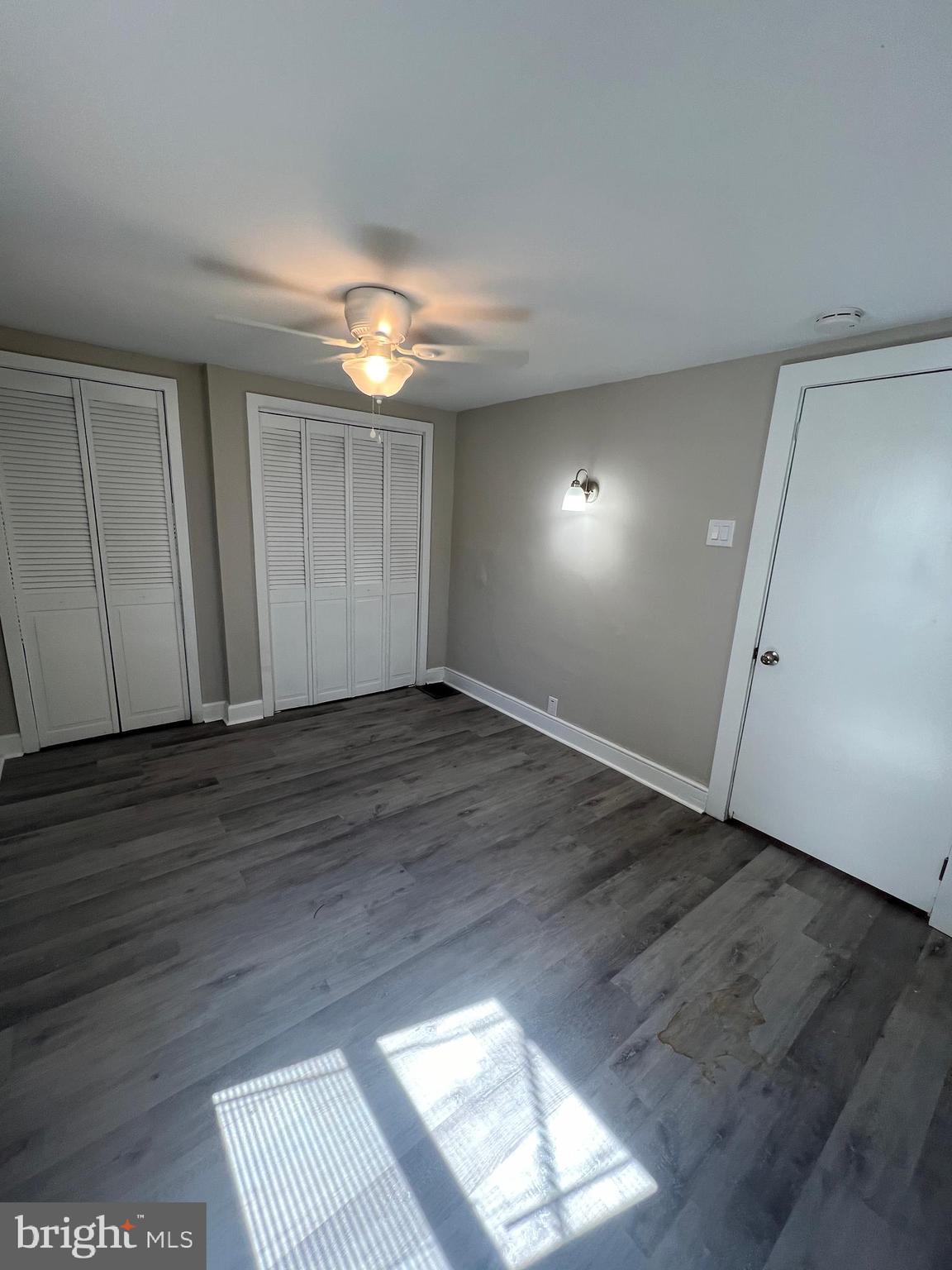 30 Spruce Avenue, Unit A Maple Shade, NJ 08052 - Photo 33 of 71 a view of an empty room with wooden floor and a window