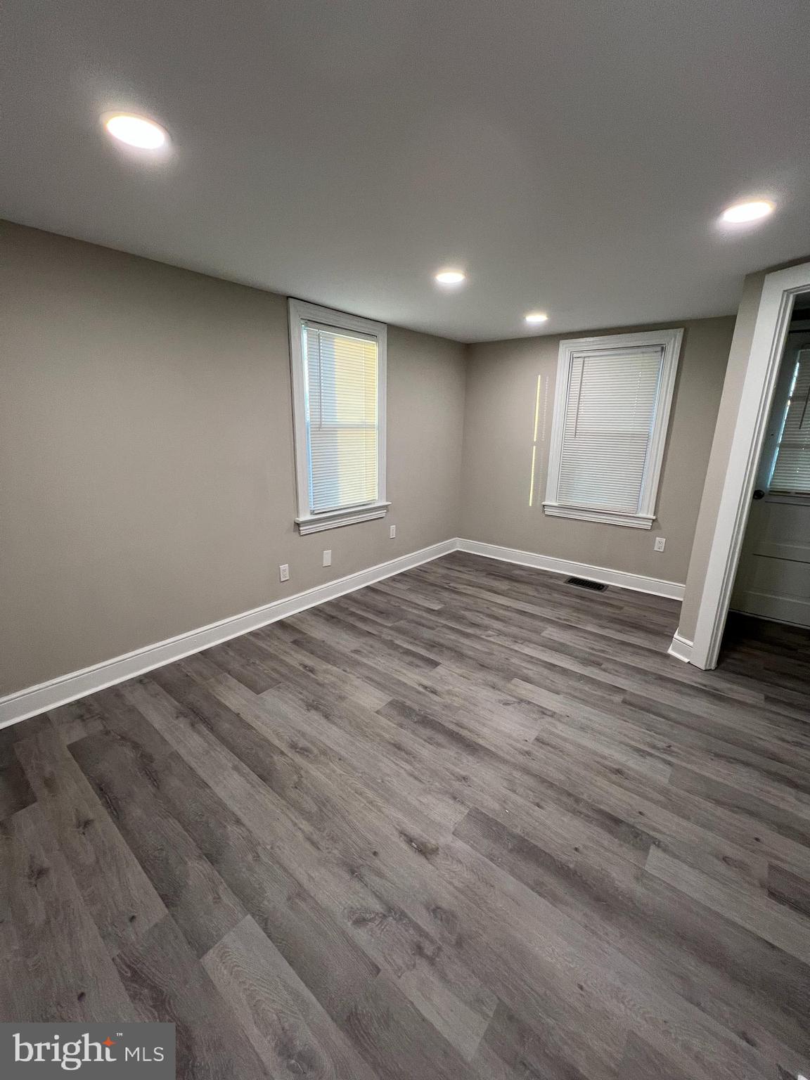 30 Spruce Avenue, Unit A Maple Shade, NJ 08052 - Photo 7 of 71 an empty room with wooden floor and windows