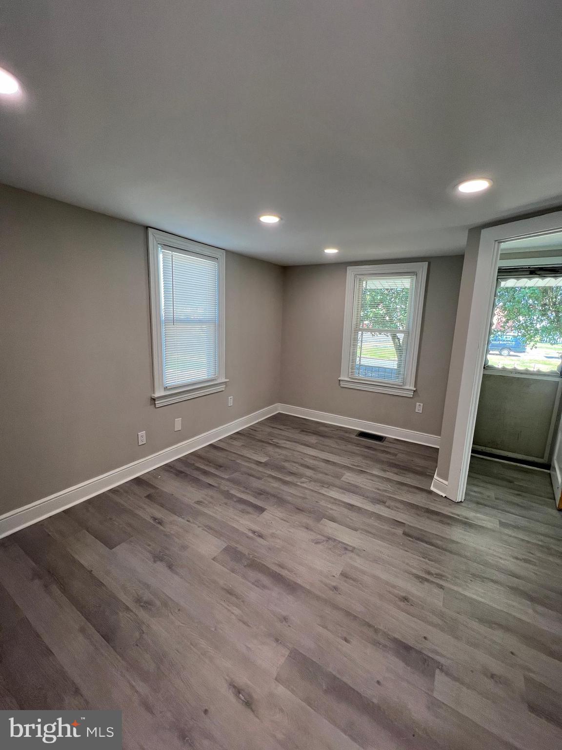 30 Spruce Avenue, Unit A Maple Shade, NJ 08052 - Photo 9 of 71 an empty room with wooden floor and windows