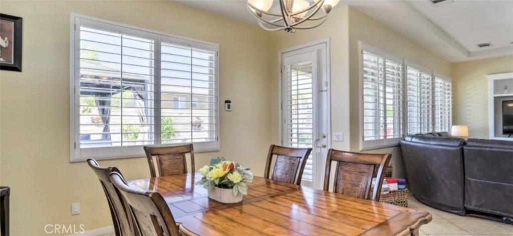 43277 Sentiero Drive Indio, CA 92203 - Photo 11 of 54 a view of a dining room with furniture window and outside view