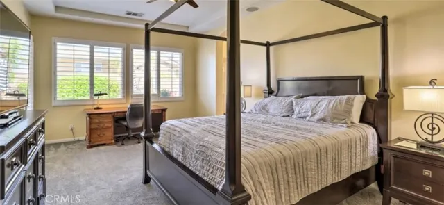 a bedroom with a bed and a table in it