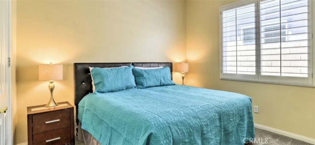 43277 Sentiero Drive Indio, CA 92203 - Photo 24 of 54 a bedroom with a bed and a window