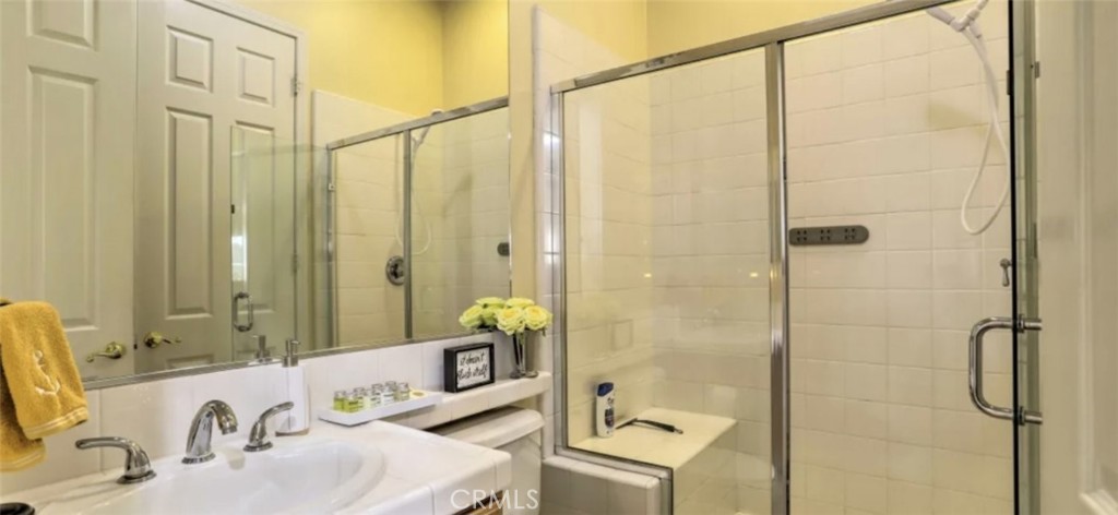 43277 Sentiero Drive Indio, CA 92203 - Photo 25 of 54 a bathroom with a sink and a mirror