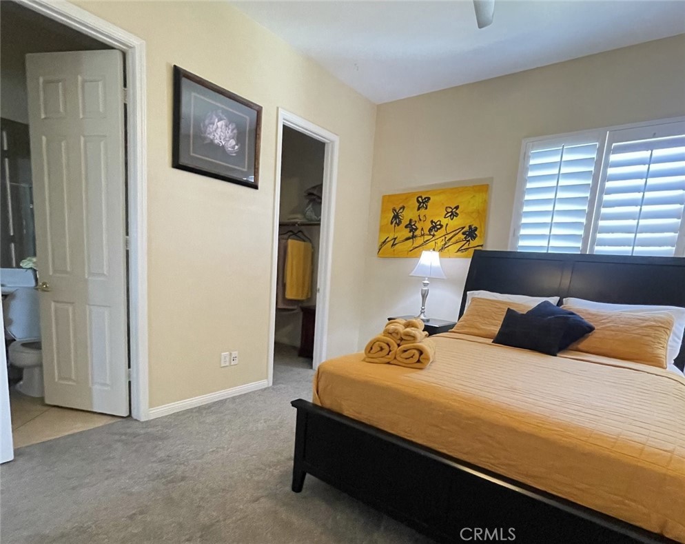 43277 Sentiero Drive Indio, CA 92203 - Photo 30 of 54 a bedroom with bed and a window