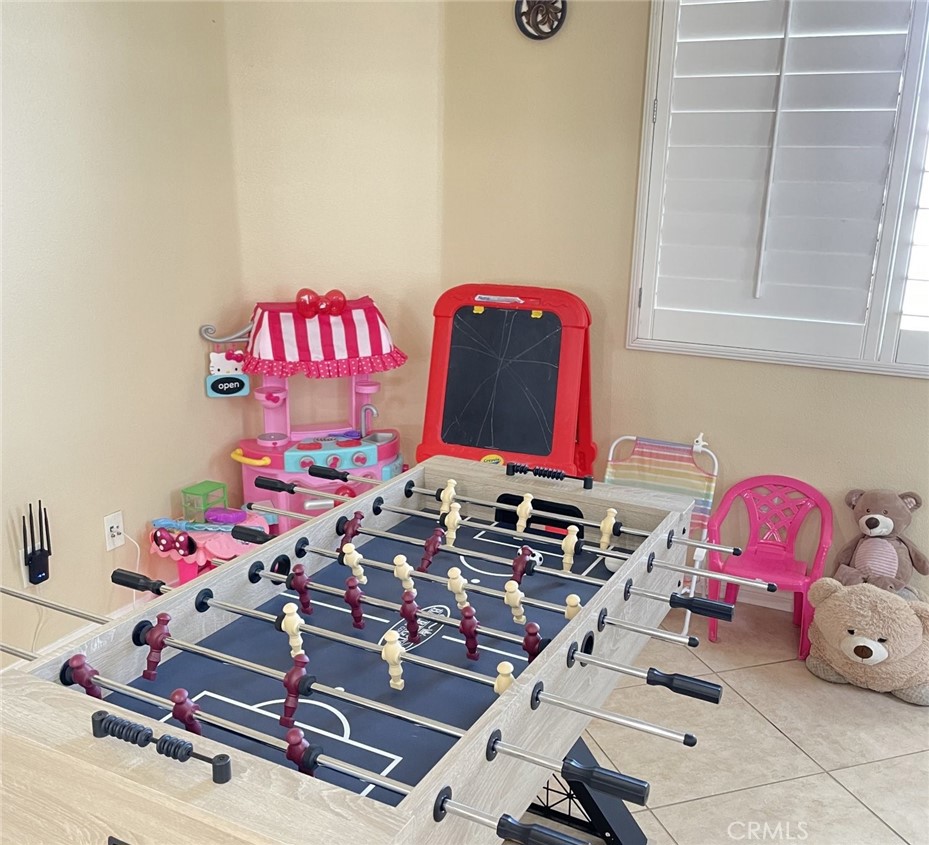 43277 Sentiero Drive Indio, CA 92203 - Photo 32 of 54 a room with toys and wooden floor