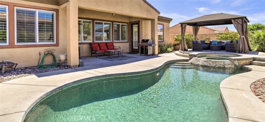 43277 Sentiero Drive Indio, CA 92203 - Photo 34 of 54 a swimming pool with outdoor seating yard and outdoor seating