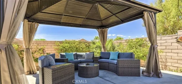 a view of outdoor sitting area with furniture