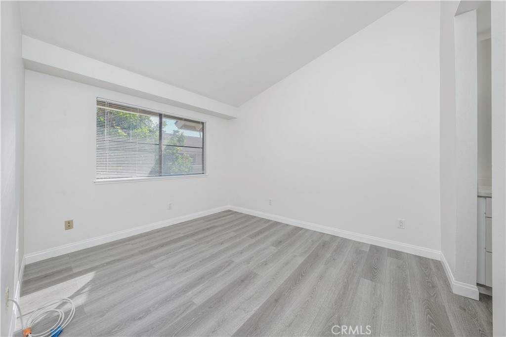 12660 Briarglen Loop, Unit G Stanton, CA 90680 - Photo 17 of 38 an empty room with a window