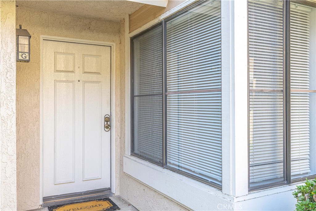 12660 Briarglen Loop, Unit G Stanton, CA 90680 - Photo 4 of 38 a view of a room that has a window in it