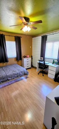 a bathroom with a toilet a sink and a window
