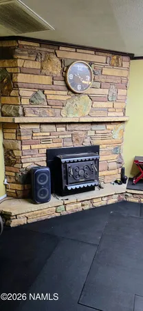 a living room with furniture and flat screen tv