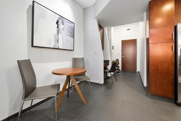 a kitchen with stainless steel appliances granite countertop a stove refrigerator and a sink