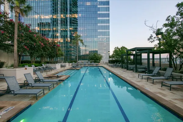a view of swimming pool with chairs