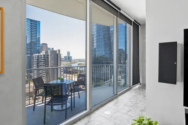 a view of balcony with furniture