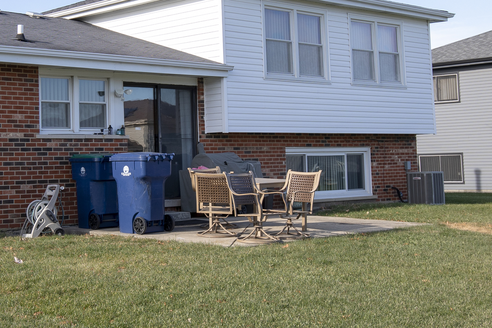 433 Highland Road Matteson, IL 60443 - Photo 2 of 27 a view of a house with patio and a yard