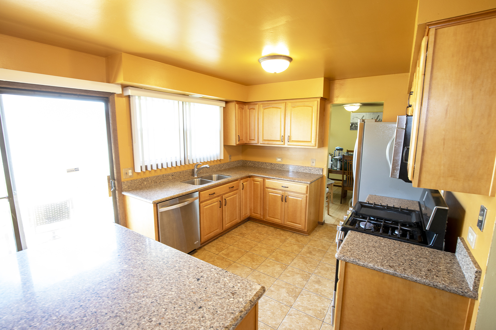 433 Highland Road Matteson, IL 60443 - Photo 11 of 27 a kitchen with a refrigerator sink and stove