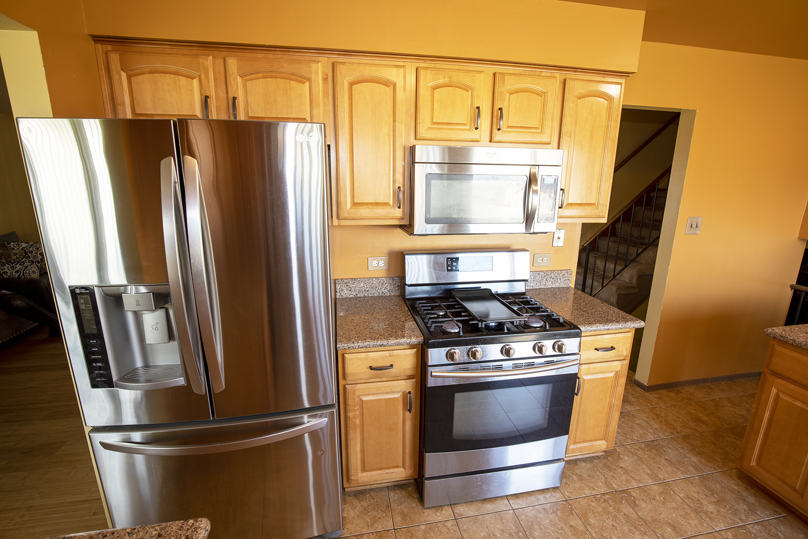433 Highland Road Matteson, IL 60443 - Photo 12 of 27 a kitchen with stainless steel appliances granite countertop a refrigerator and a stove