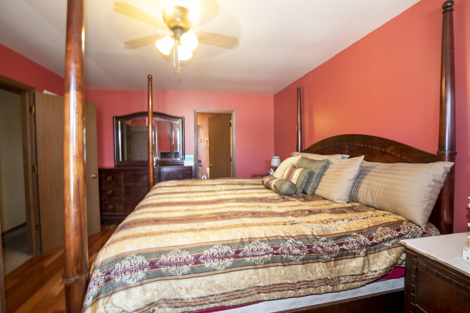 433 Highland Road Matteson, IL 60443 - Photo 17 of 27 a bedroom with a bed and a chandelier