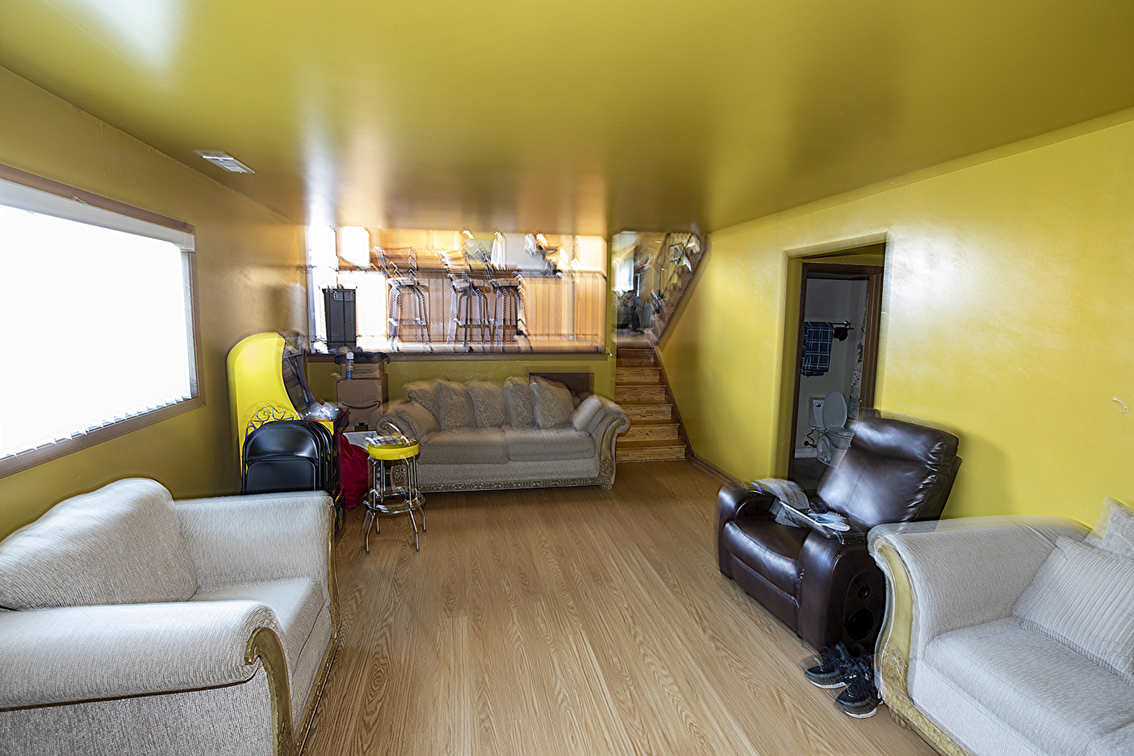 433 Highland Road Matteson, IL 60443 - Photo 23 of 27 a living room with furniture and a chandelier