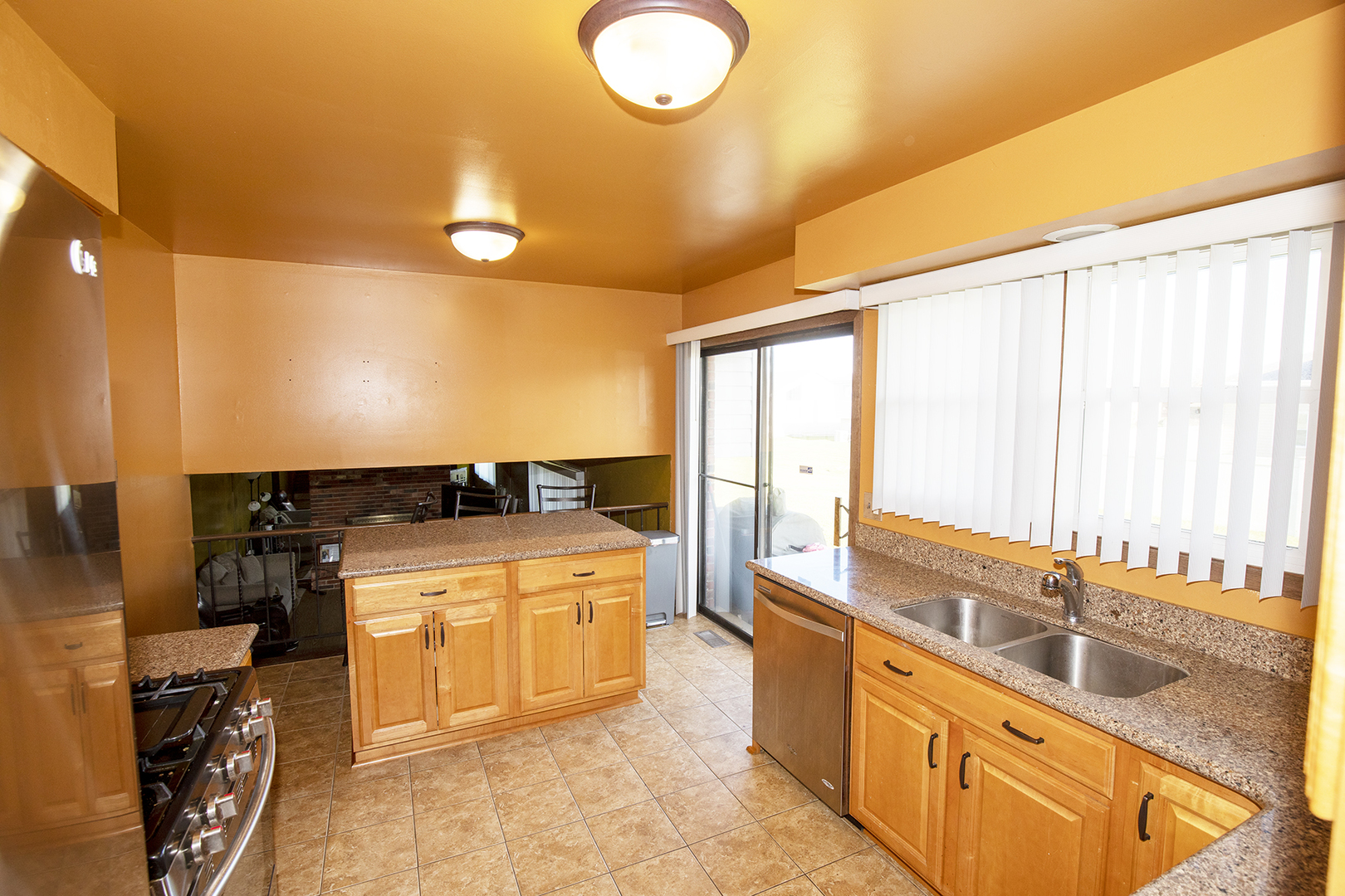 433 Highland Road Matteson, IL 60443 - Photo 9 of 27 a large kitchen with stainless steel appliances granite countertop a sink and cabinets